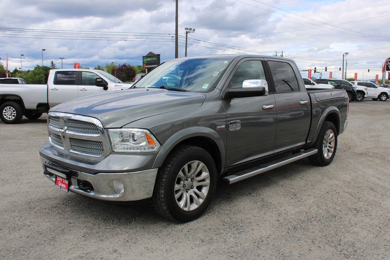 2013 RAM 1500 Laramie Longhorn 4x4 4dr Crew Cab 5.5 ft. SB Pickup in Mineral Gray Metallic Clear Coat — front three-quarter view