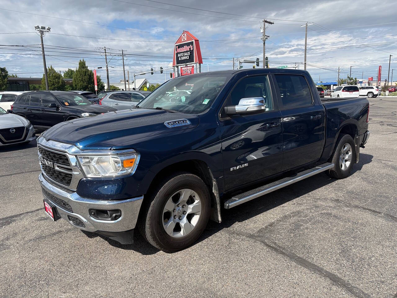 2022 RAM 1500 Lone Star 4x4 4dr Crew Cab 5.6 ft. SB Pickup in Steel Blue Metallic Clear Coat — front three-quarter view