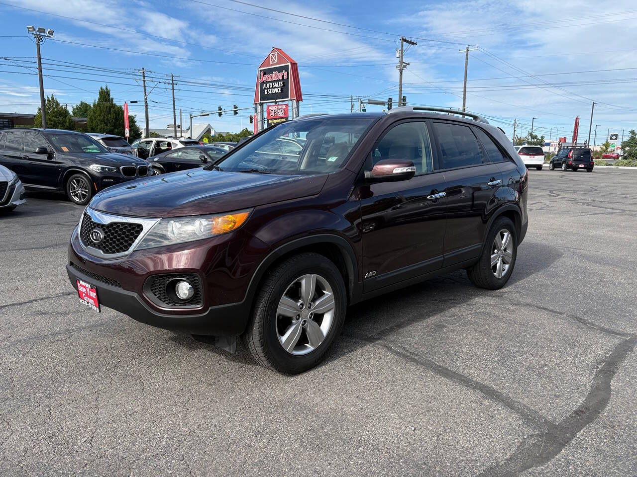 2012 Kia Sorento EX AWD 4dr SUV in Dark Cherry — front three-quarter view