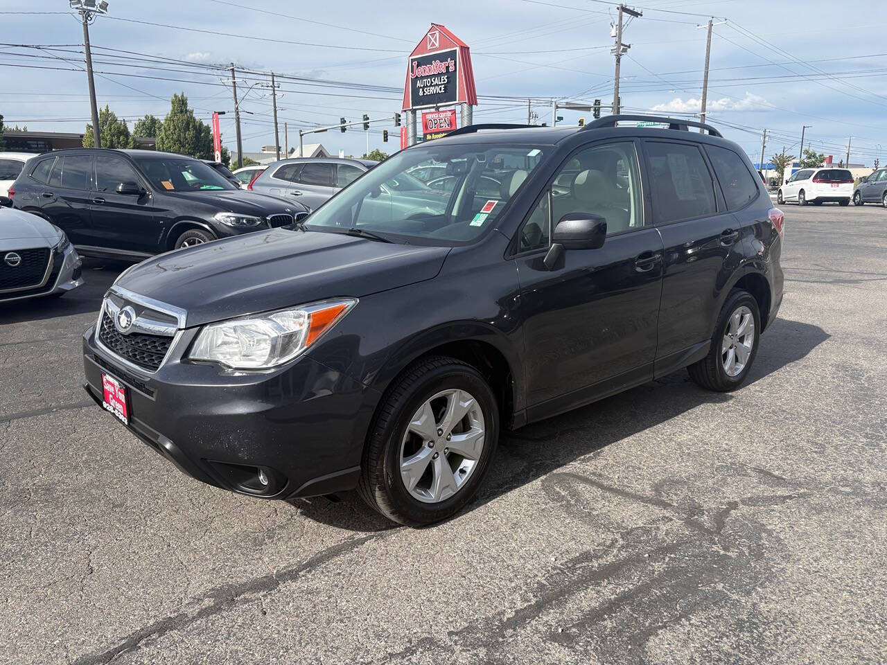 2016 Subaru Forester 2.5i Premium AWD 4dr Wagon CVT in Dark Gray Metallic — front three-quarter view